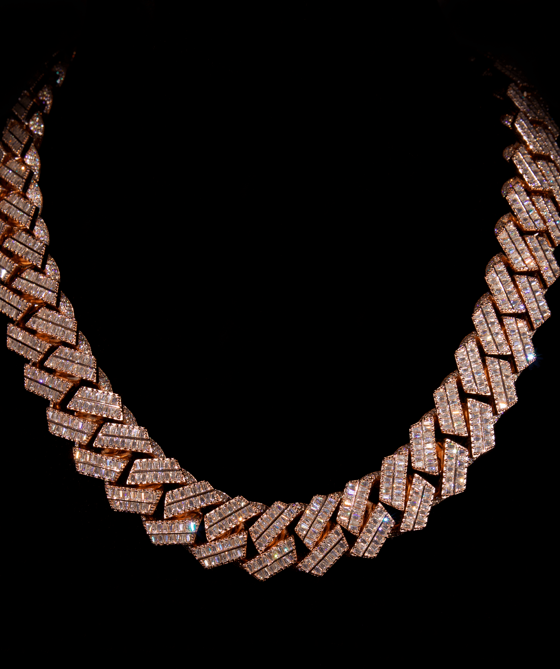 ICED London diamond-studded Cuban link necklace on a black background, close-up view highlighting pavé diamonds.