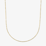 ICED London gold chain necklace with delicate curb links, minimalist jewelry on white background.