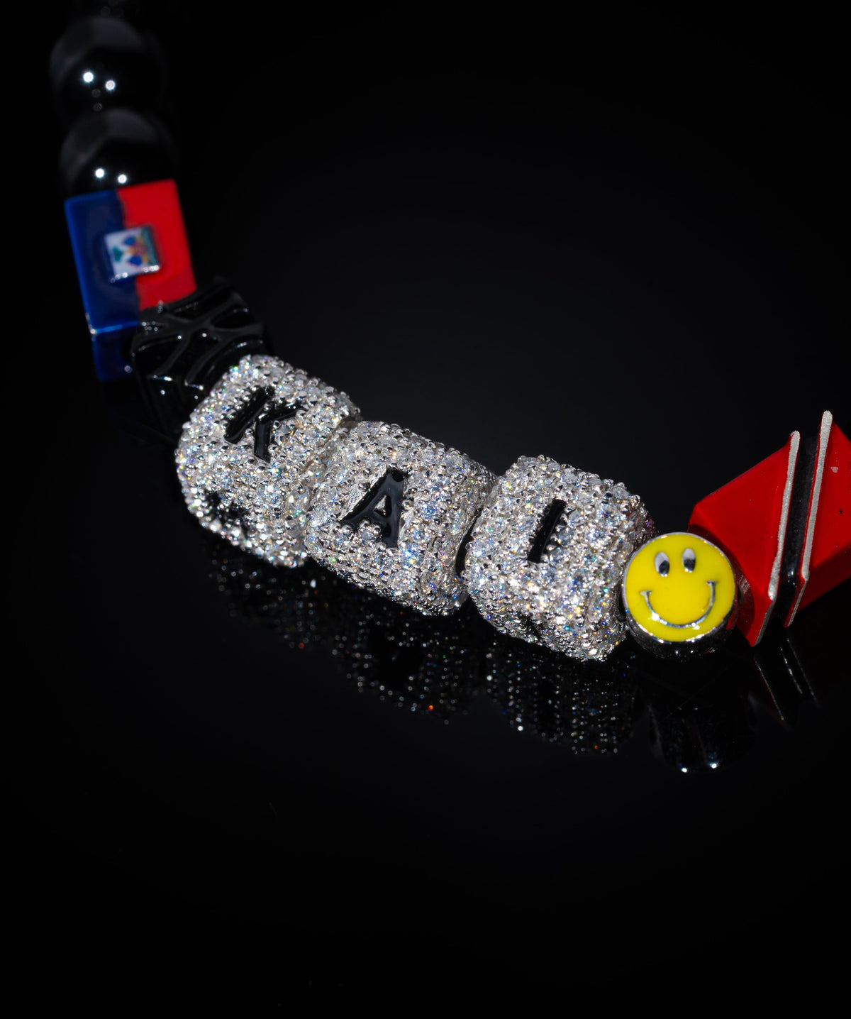 Kai Cenat bracelet — iced KAI cubes, flags and smiley detail