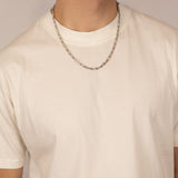ICED London silver chain necklace worn by male model in a white crew-neck T-shirt.