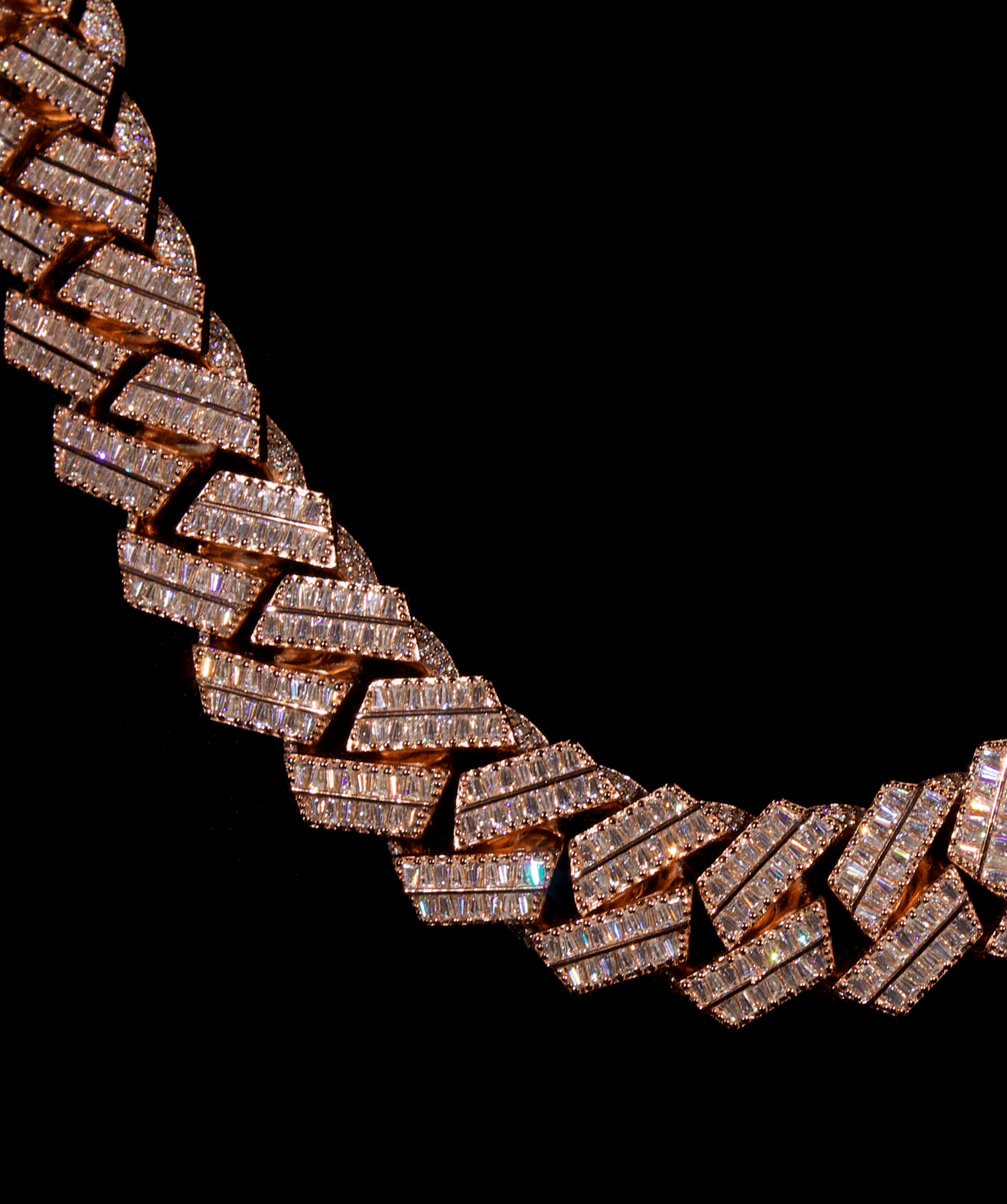 ICED London diamond bracelet with rectangular, sparkly links on a black background.