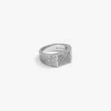 ICED London diamond‑encrusted wide band ring with pavé stones on silver metal against white background.