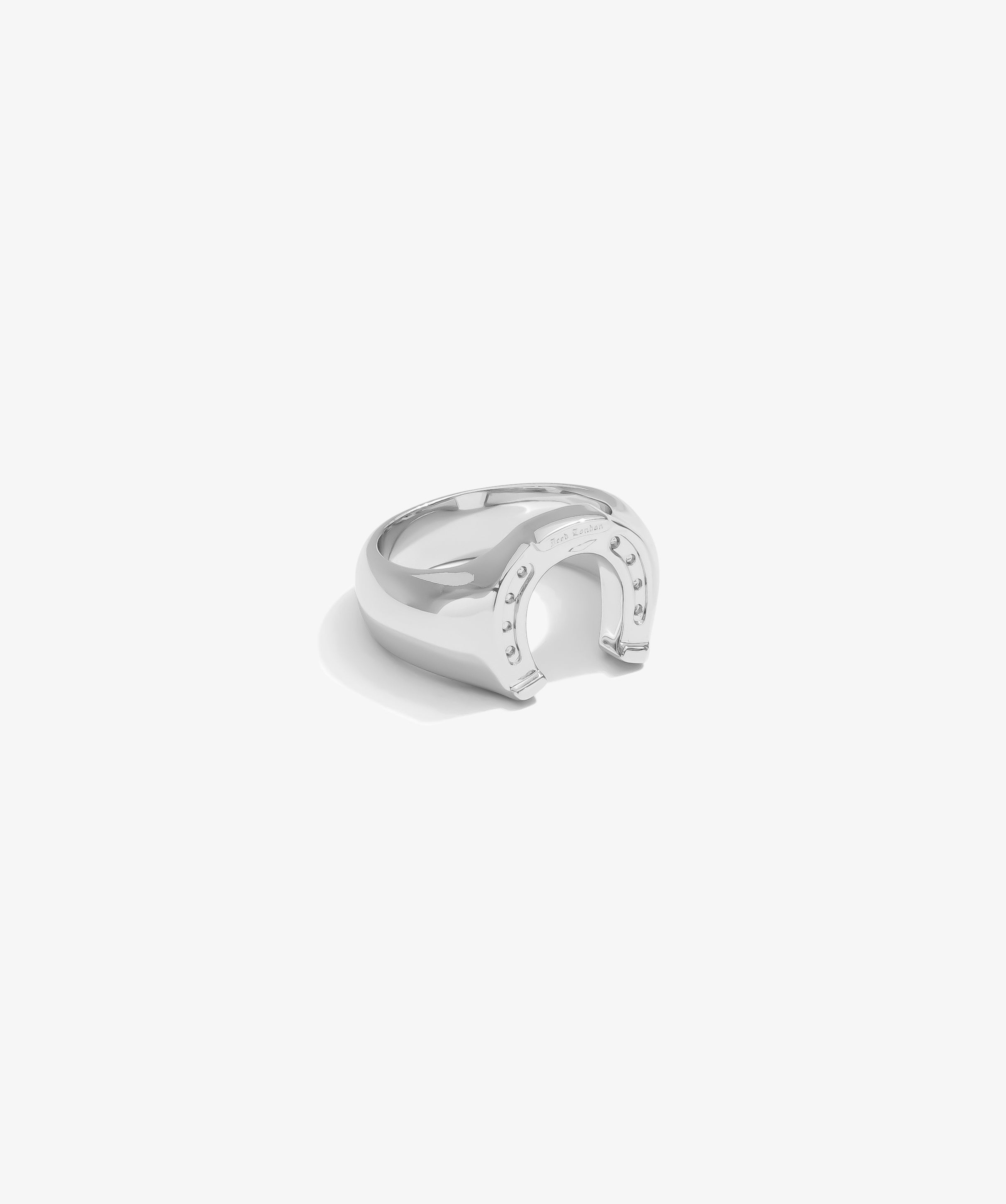 ICED London silver ring with an open crescent design and embedded studs, studio product shot.