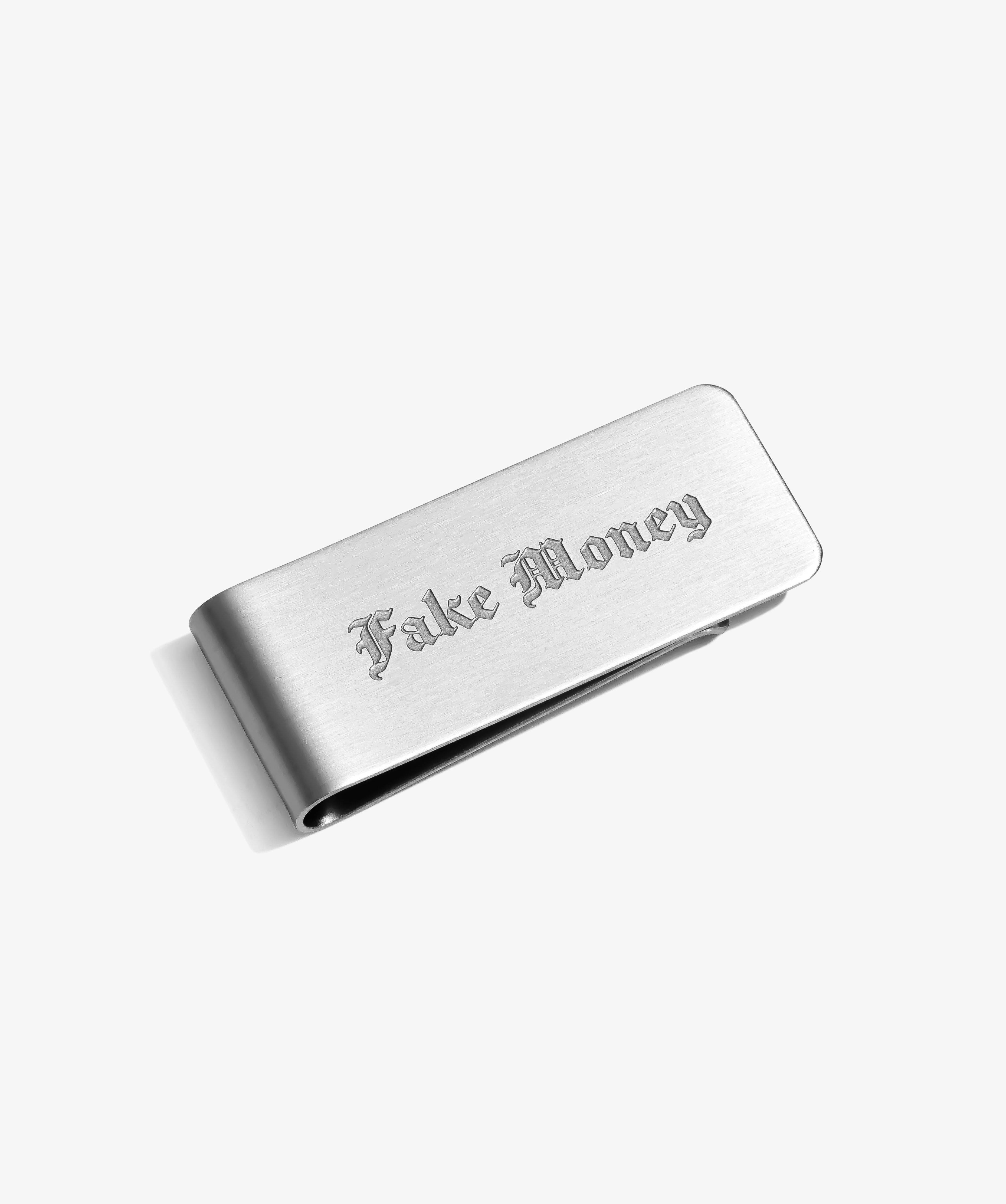 ICED London metal wallet with brushed steel finish, engraved "Fake Money" in Gothic font, minimalist cash-clip design.