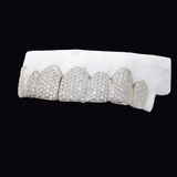 ICED London diamond-encrusted dental grill set on a white dental mold, close-up shot.