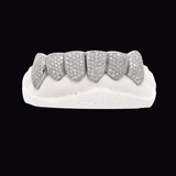 ICED London diamond grillz on a white dental mold; pavé-set tooth jewelry.